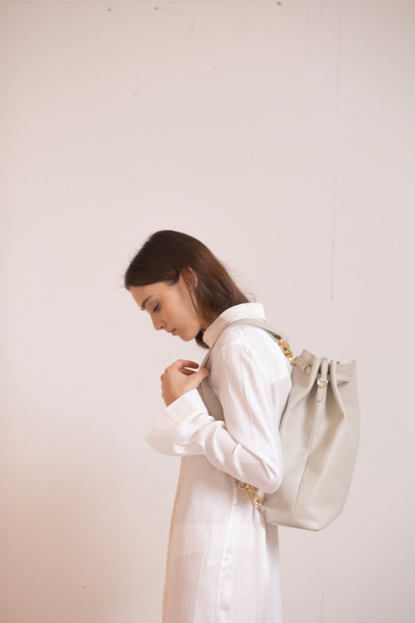 This luxury ecru leather backpack / Laptop Bag can be worn as a backpack or a shoulder back and fits everything inc your laptop. Chic, elegant & minimalist design. In colours ecru and tan. Ideal for any casual oufit or and elegant classic day look. Perfect bag for womens work wear, office style or travelling.